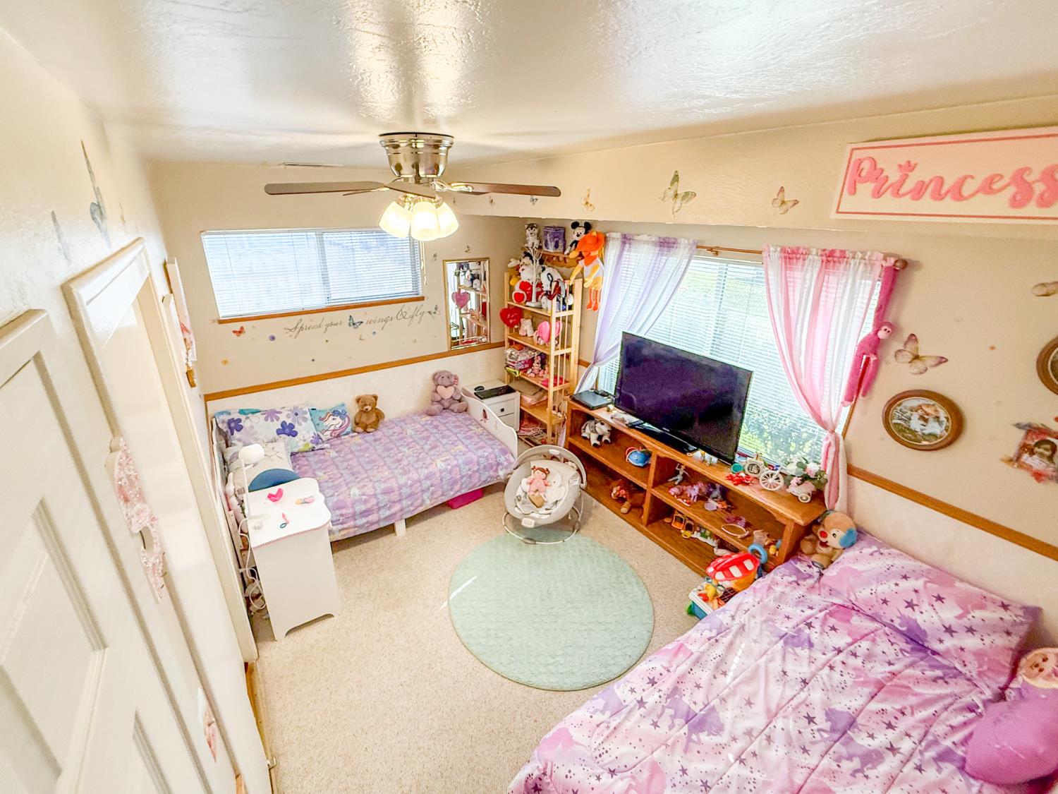 161 Ribier Avenue Modesto, CA 95350 - Photo 14 of 26 a bedroom with a bed and a window