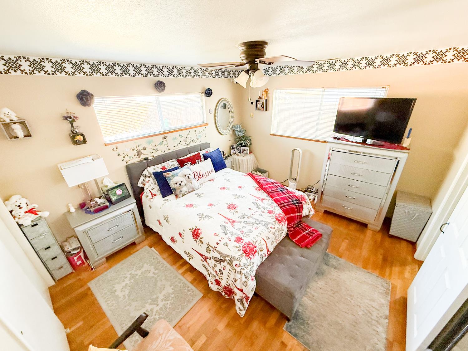 161 Ribier Avenue Modesto, CA 95350 - Photo 16 of 26 a bedroom with a bed and flat screen tv