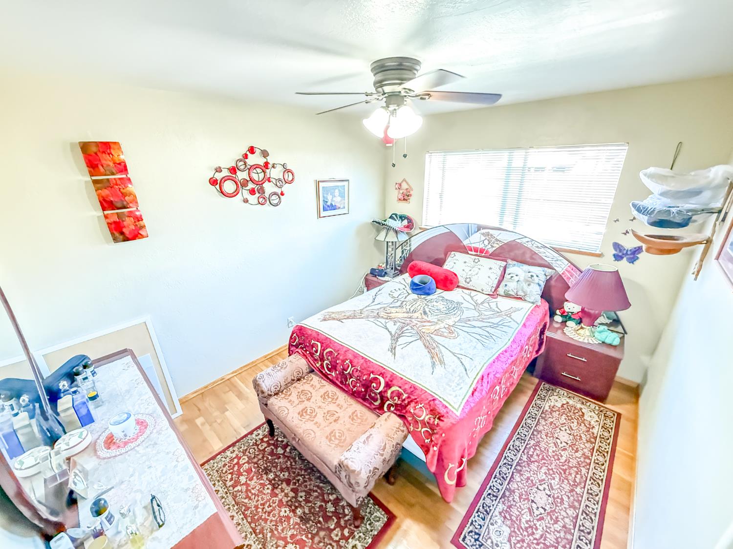 161 Ribier Avenue Modesto, CA 95350 - Photo 19 of 26 a bedroom with a bed and a table in it