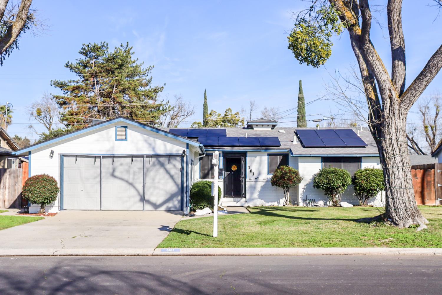 161 Ribier Avenue Modesto, CA 95350 - Photo 2 of 26 a front view of a house with garden
