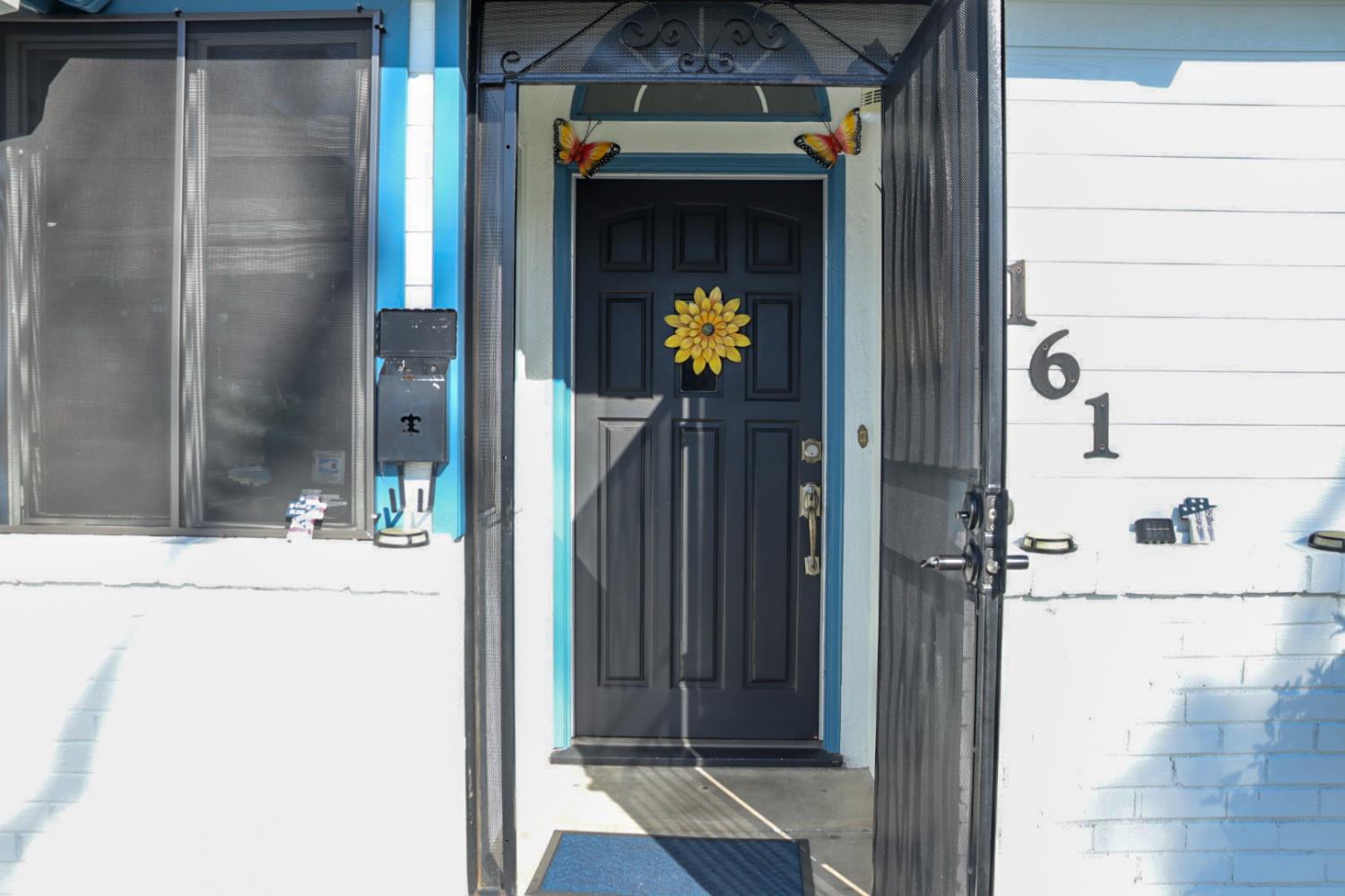161 Ribier Avenue Modesto, CA 95350 - Photo 5 of 26 a view of a entryway door of the house