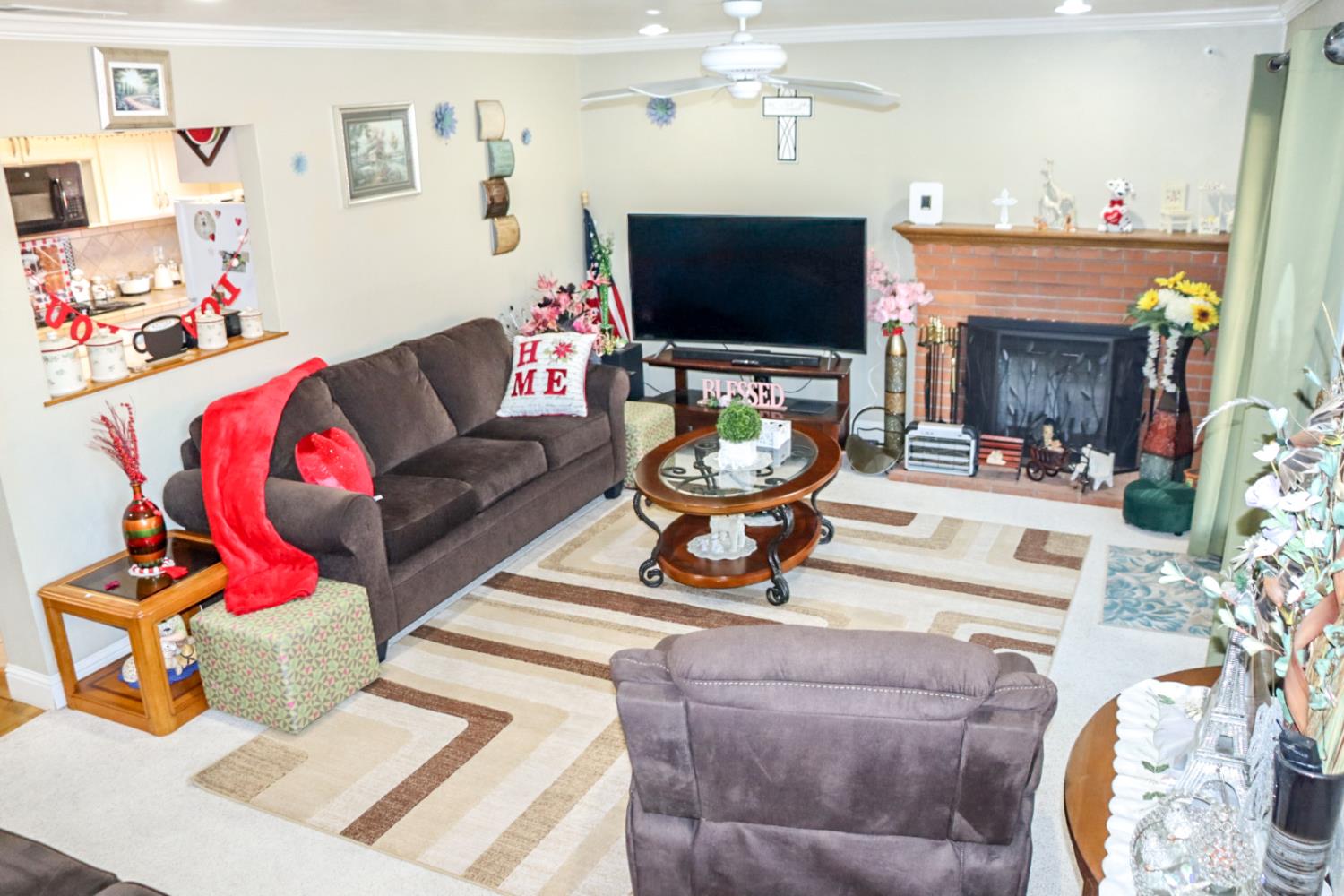 161 Ribier Avenue Modesto, CA 95350 - Photo 8 of 26 a living room with furniture a flat screen tv and a flat screen tv