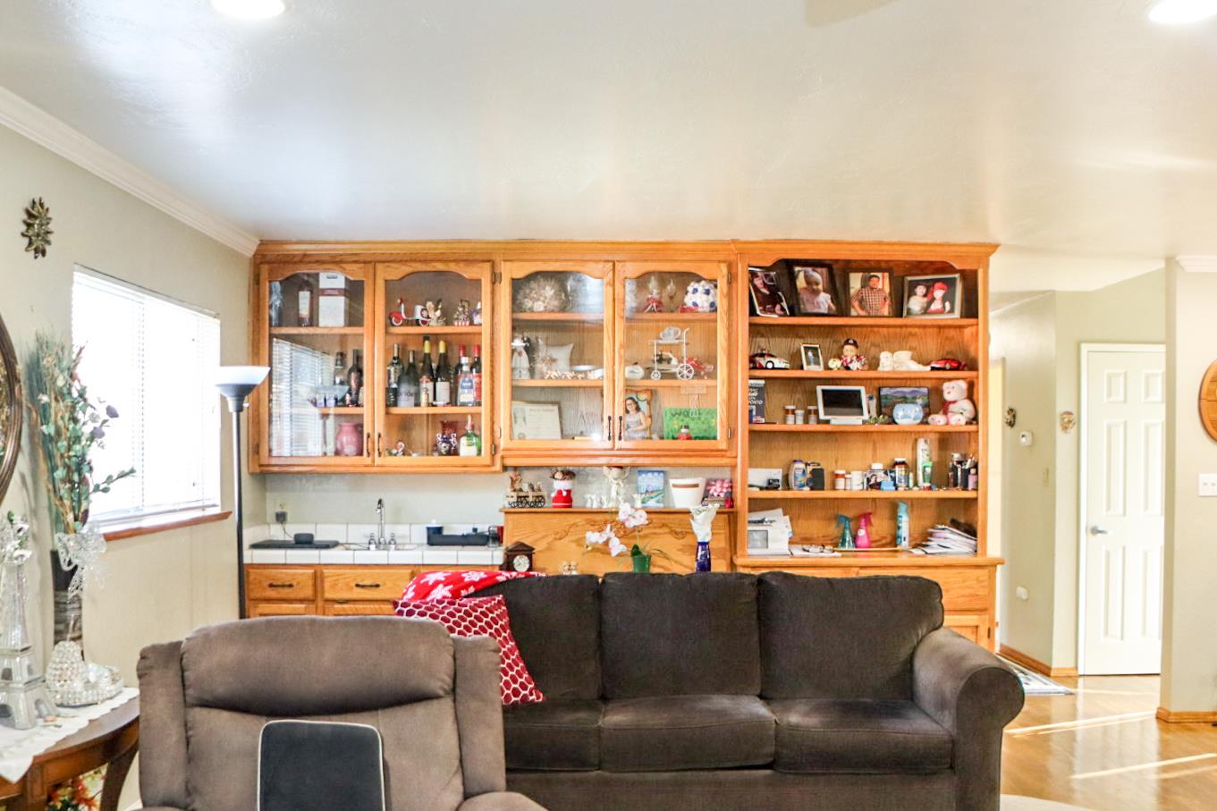 161 Ribier Avenue Modesto, CA 95350 - Photo 9 of 26 a living room with furniture and a large window