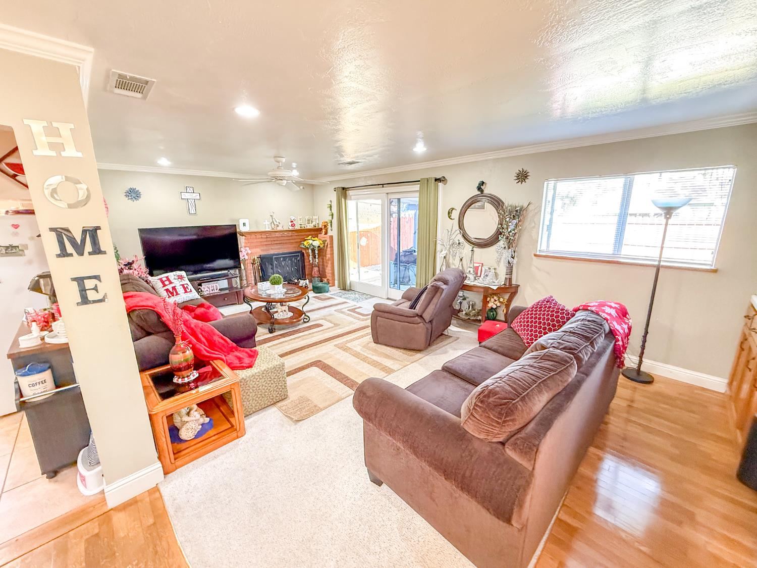 161 Ribier Avenue Modesto, CA 95350 - Photo 10 of 26 a living room with furniture and a flat screen tv