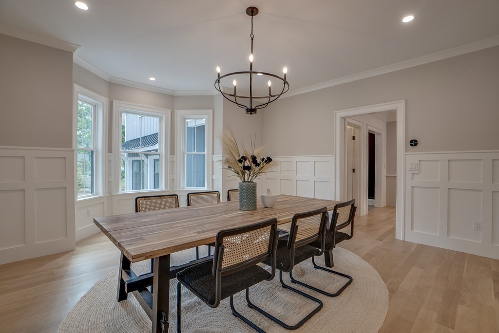 25 Webber Avenue Bedford, MA 01730 - Photo 11 of 42 a view of a dining room with furniture window and wooden floor