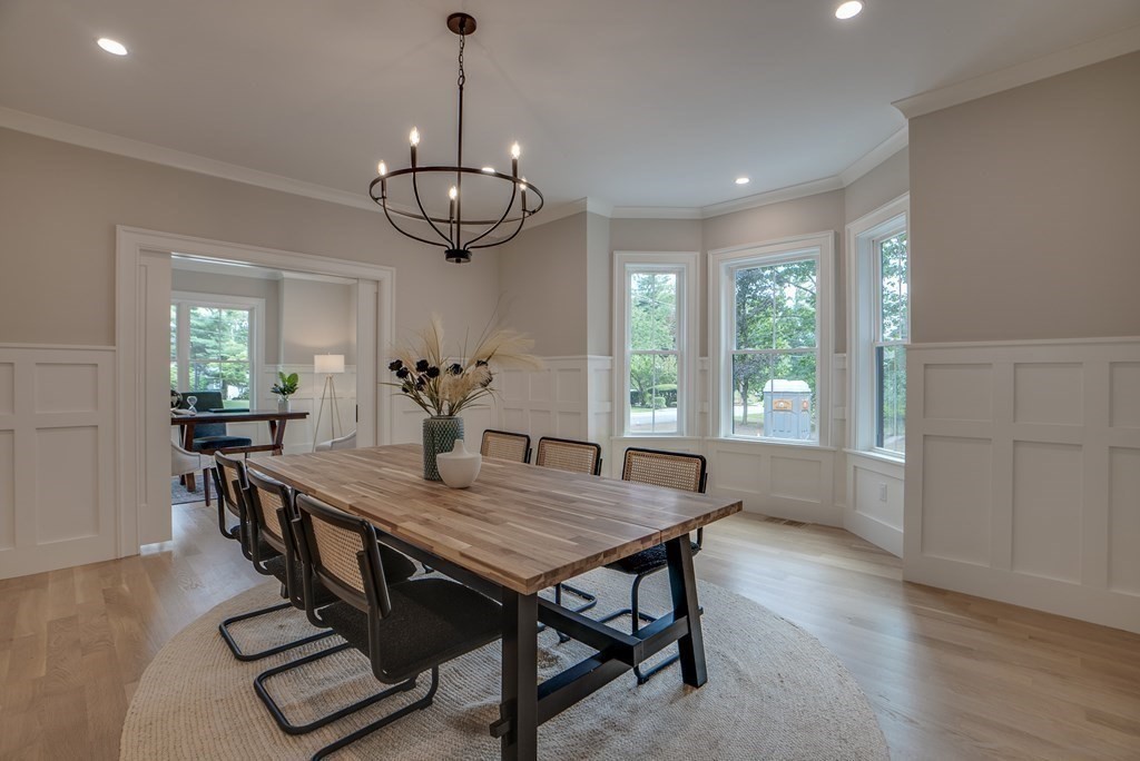 25 Webber Avenue Bedford, MA 01730 - Photo 12 of 42 a view of a dining room with furniture window and wooden floor