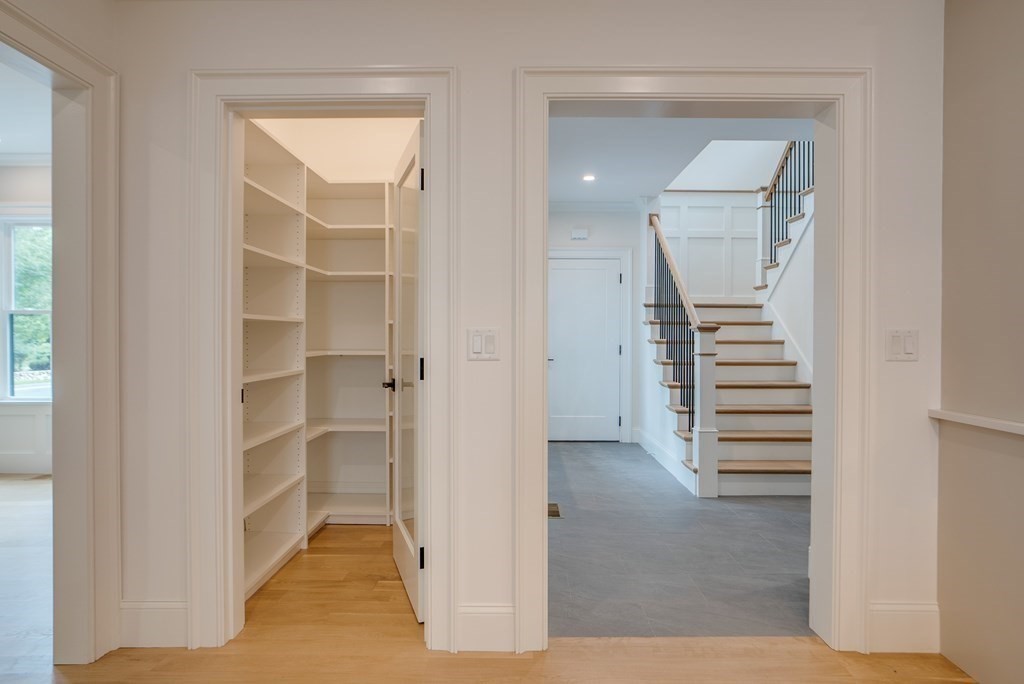 25 Webber Avenue Bedford, MA 01730 - Photo 18 of 42 a view of walk in closet with empty racks
