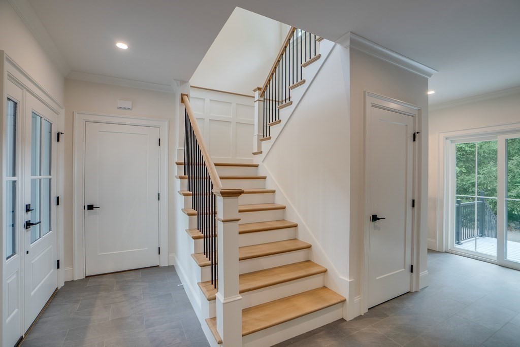 25 Webber Avenue Bedford, MA 01730 - Photo 19 of 42 a view of a hallway with staircase