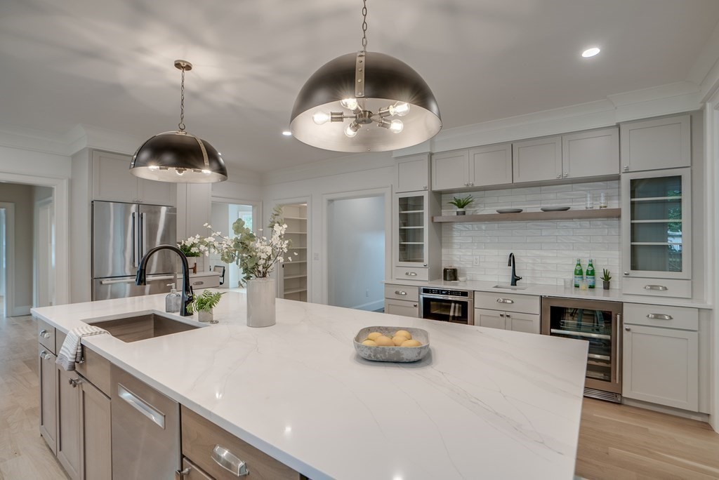 25 Webber Avenue Bedford, MA 01730 - Photo 2 of 42 a kitchen with a counter space cabinets and stainless steel appliances