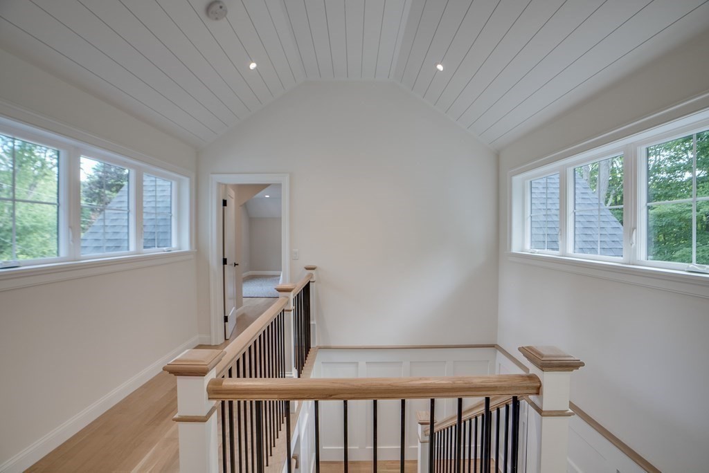 25 Webber Avenue Bedford, MA 01730 - Photo 21 of 42 a view of an empty room with wooden floor and a window