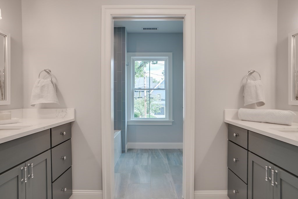 25 Webber Avenue Bedford, MA 01730 - Photo 31 of 42 a bathroom with a sink a vanity and a mirror