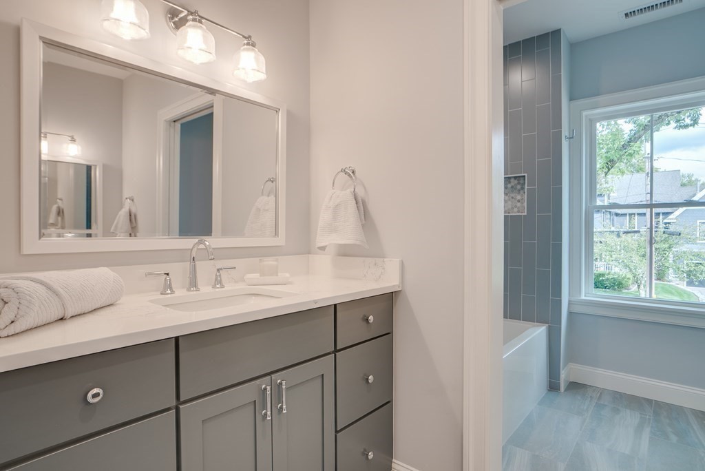 25 Webber Avenue Bedford, MA 01730 - Photo 32 of 42 a bathroom with a sink and a mirror