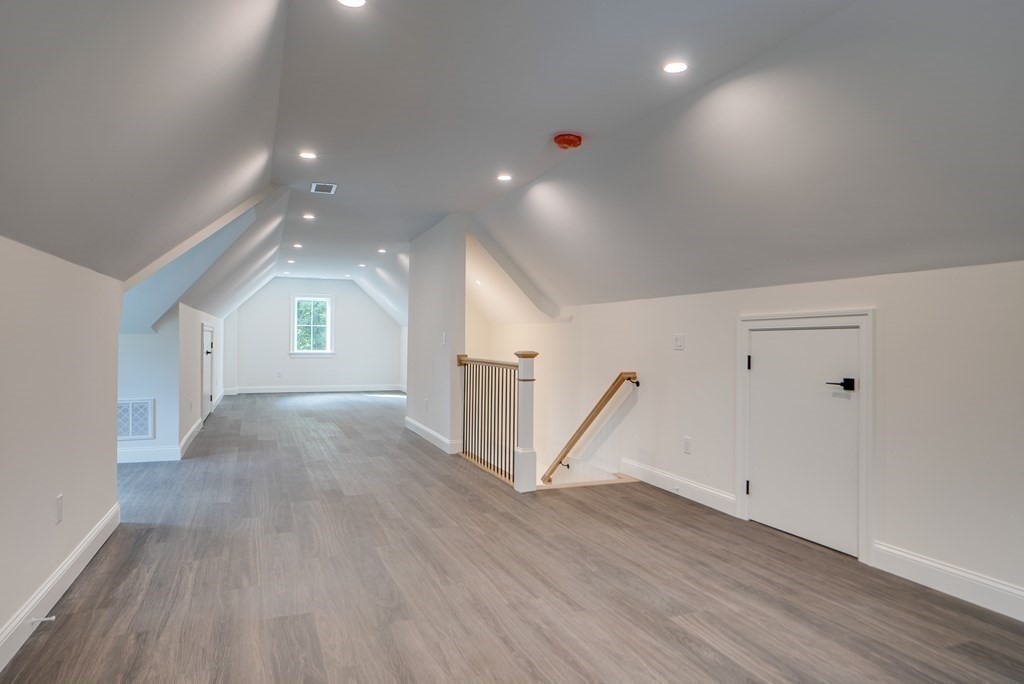 25 Webber Avenue Bedford, MA 01730 - Photo 36 of 42 wooden floor in an empty room with a window
