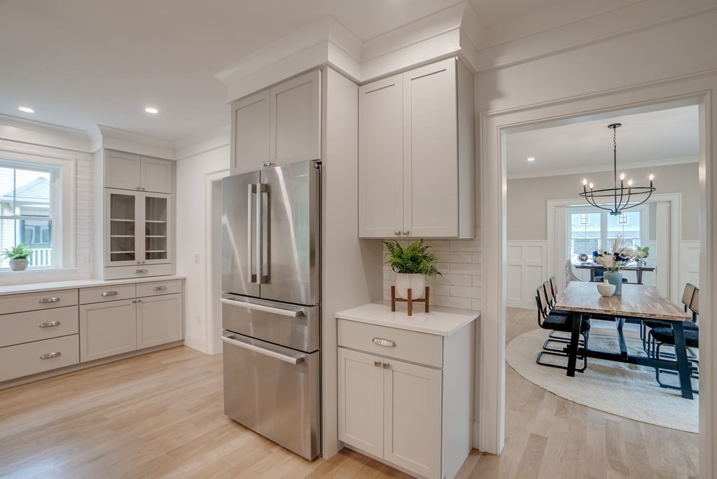 25 Webber Avenue Bedford, MA 01730 - Photo 6 of 42 a kitchen with appliances cabinets and furniture
