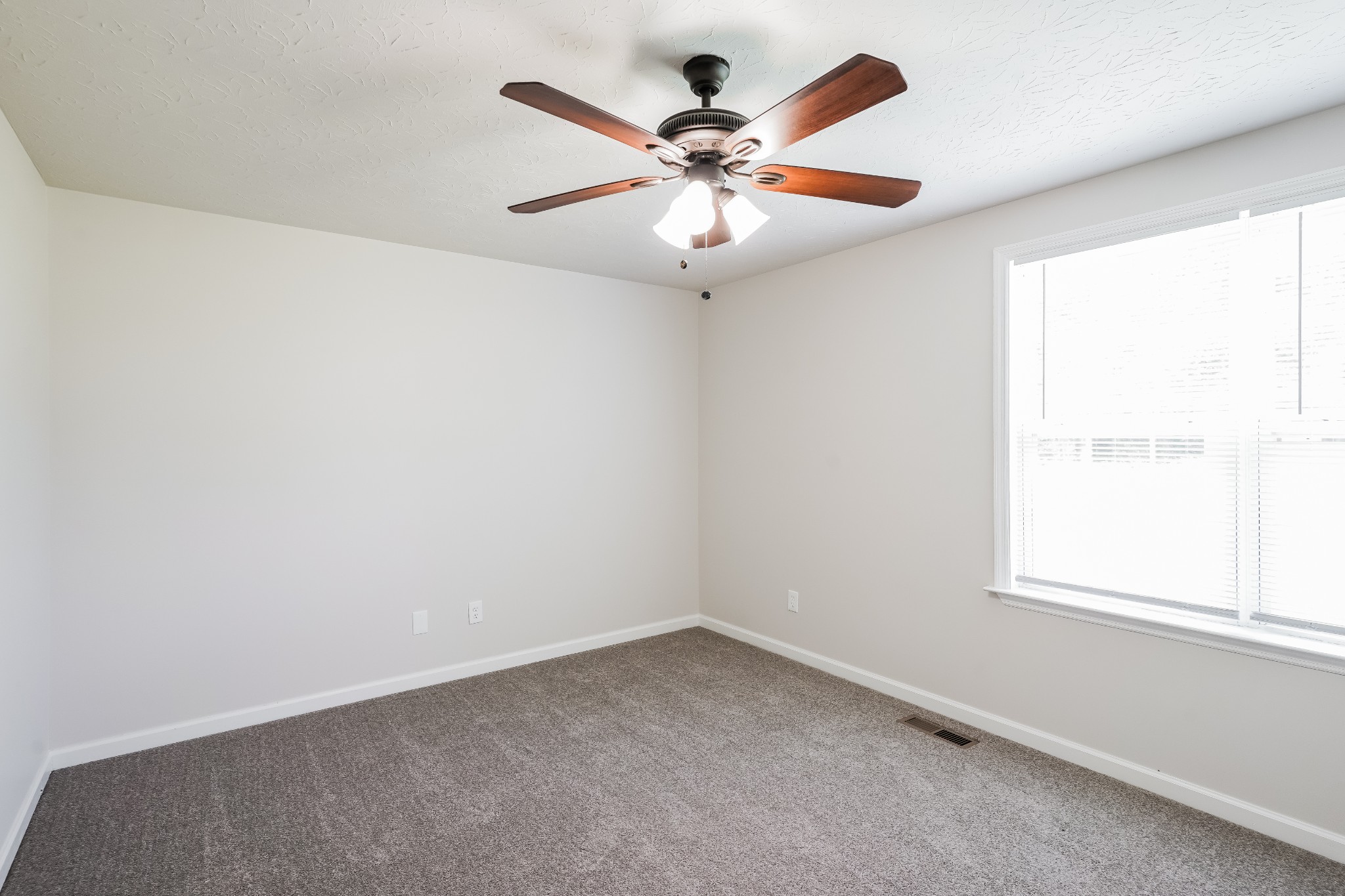 1028 William Glen Road Ashland City, TN 37015 - Photo 11 of 16 an empty room with a window and a fan