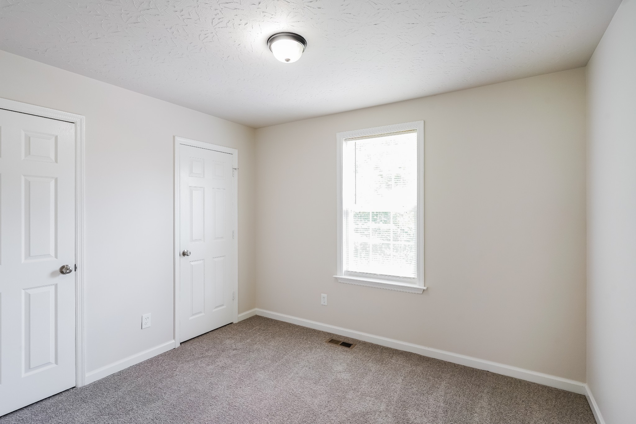 1028 William Glen Road Ashland City, TN 37015 - Photo 2 of 16 an empty room with windows