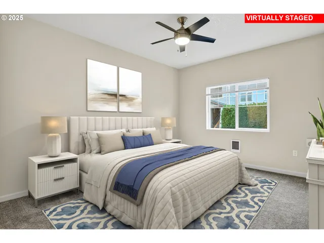 a bedroom with a large bed and a window