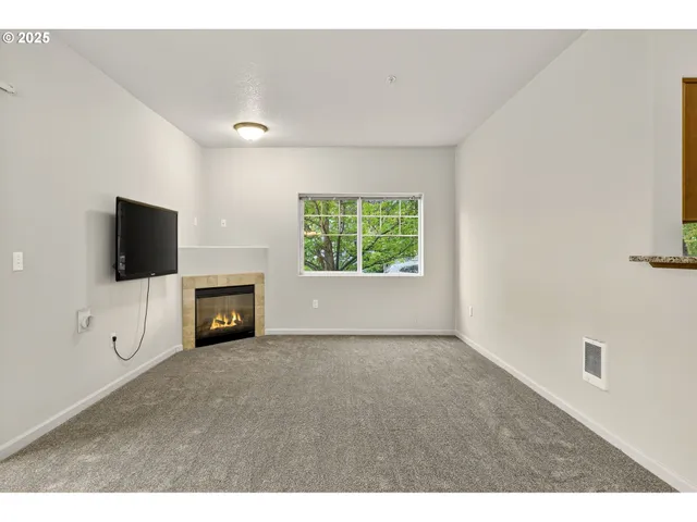 a view of an empty room with a flat screen tv