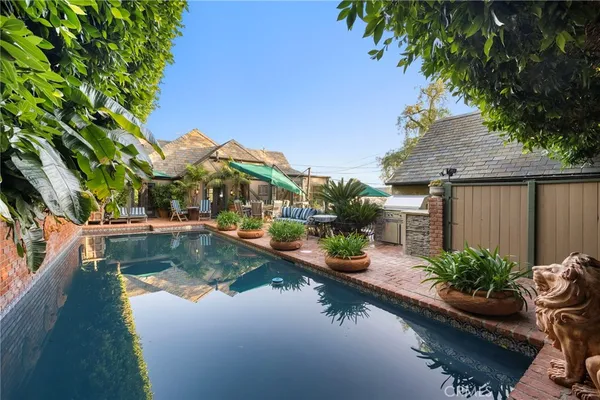a view of swimming pool with outdoor seating