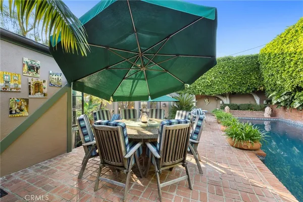 a view of a swimming pool with a patio