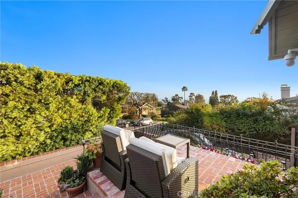 a view of a house with lounge chair and a potted plant