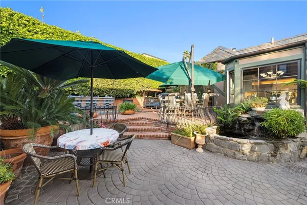a bedroom with furniture and a large window