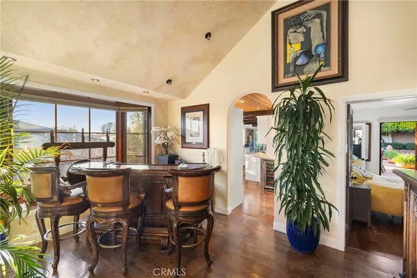 a living room with furniture large window and a fireplace