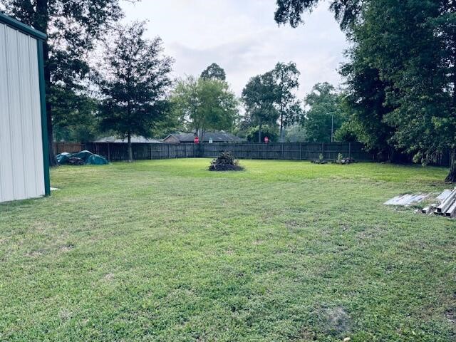 802 Fall Creek Drive Huffman, TX 77336 - Photo 17 of 17 a view of a field with a tree