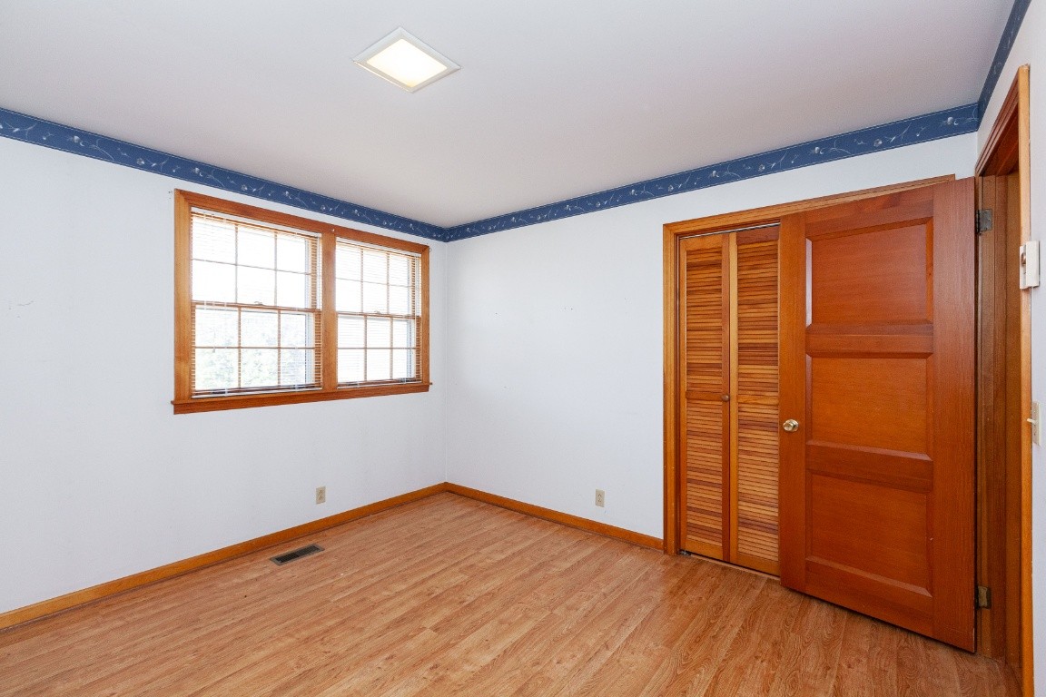 2102 Center Point Road Hendersonville, TN 37075 - Photo 31 of 50 an empty room with wooden floor and windows