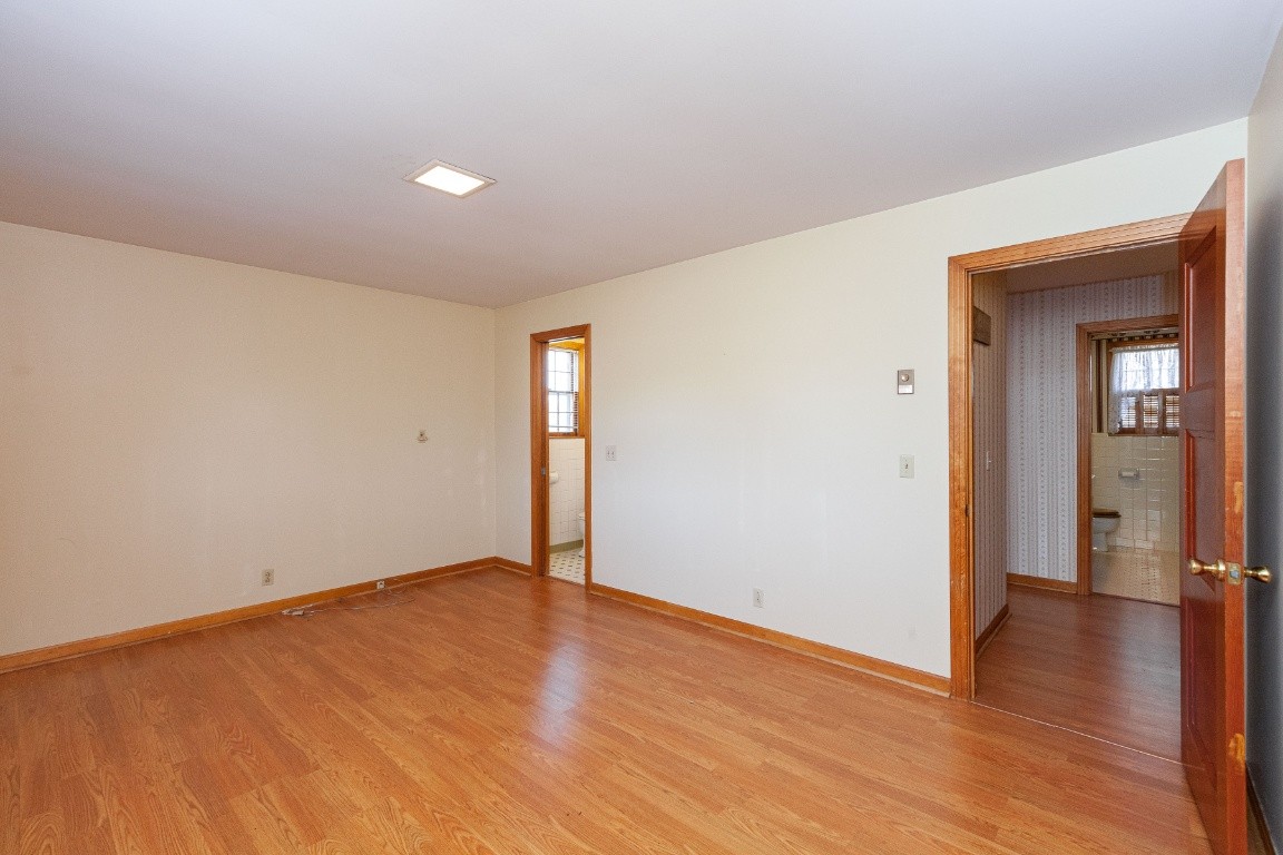 2102 Center Point Road Hendersonville, TN 37075 - Photo 32 of 50 an empty room with wooden floor and windows