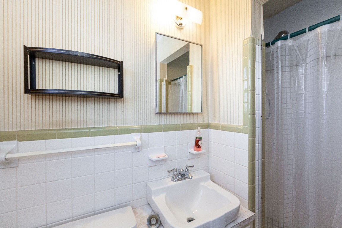 2102 Center Point Road Hendersonville, TN 37075 - Photo 35 of 50 a bathroom with a sink and a mirror