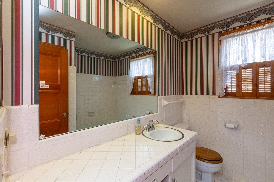2102 Center Point Road Hendersonville, TN 37075 - Photo 36 of 50 a bathroom with a granite countertop sink and a mirror