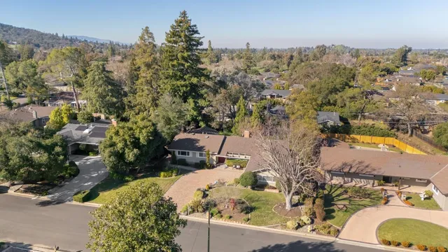an aerial view of a house with a swimming pool