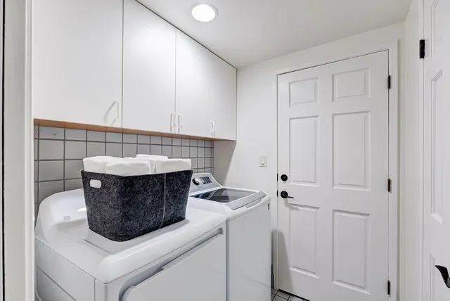 a stove top oven sitting inside of a kitchen