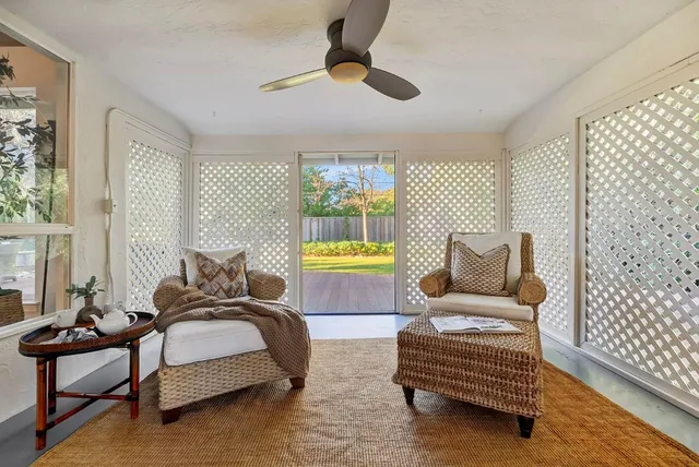 a bedroom with two beds and a chandelier