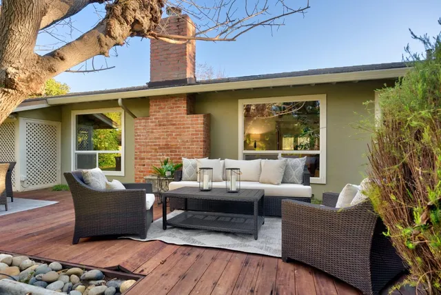a outdoor living space with patio furniture and a potted plant