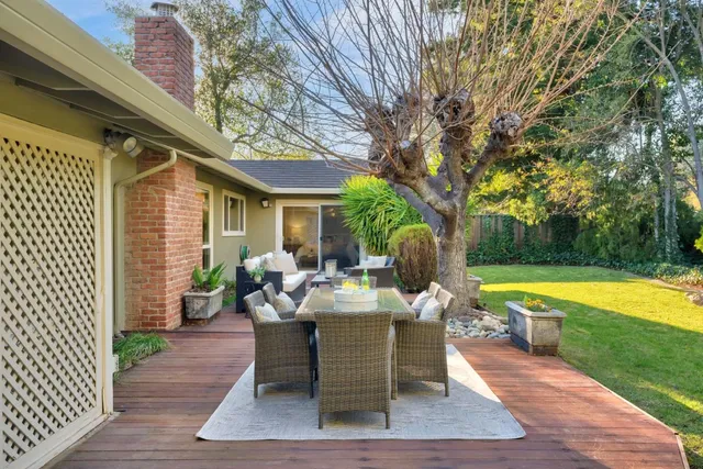 a dining room with furniture and garden