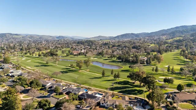 an aerial view of residential houses and outdoor space