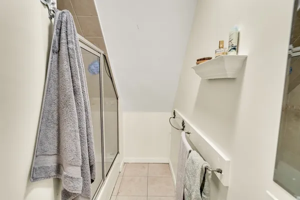 a bathroom with a bathtub and shower
