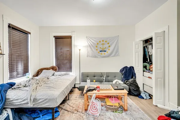 a bedroom with bed and window