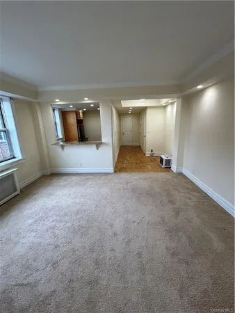 a view of a livingroom with furniture and window