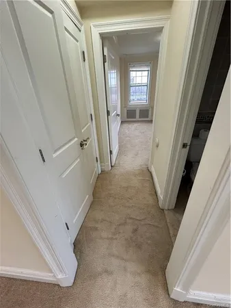 a view of a hallway view with staircase