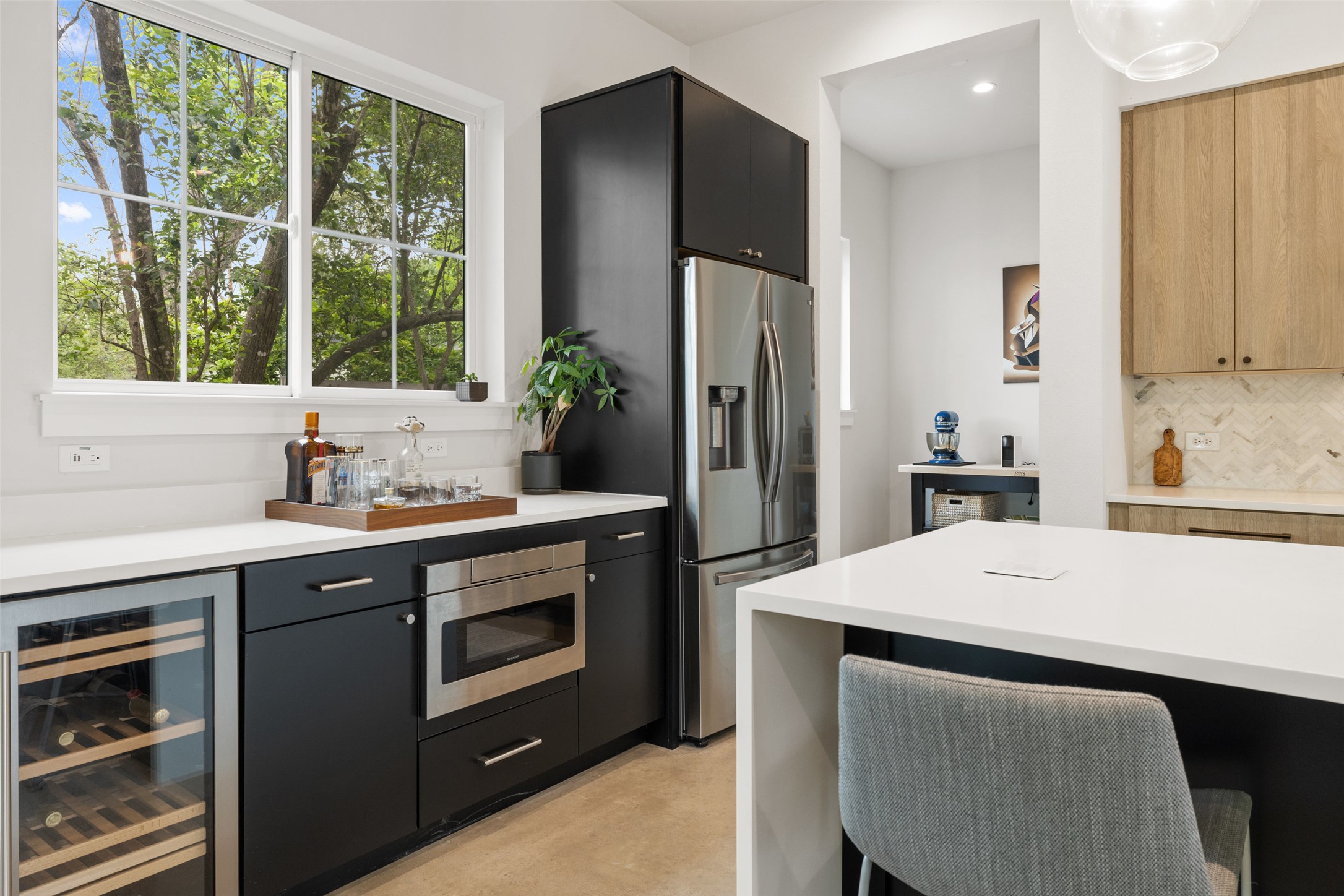 1504 Ruth Avenue, Unit 3 Austin, TX 78757 - Photo 14 of 39 Custom cabinetry and built-in appliances elevate this culinary space to a new level of functionality.