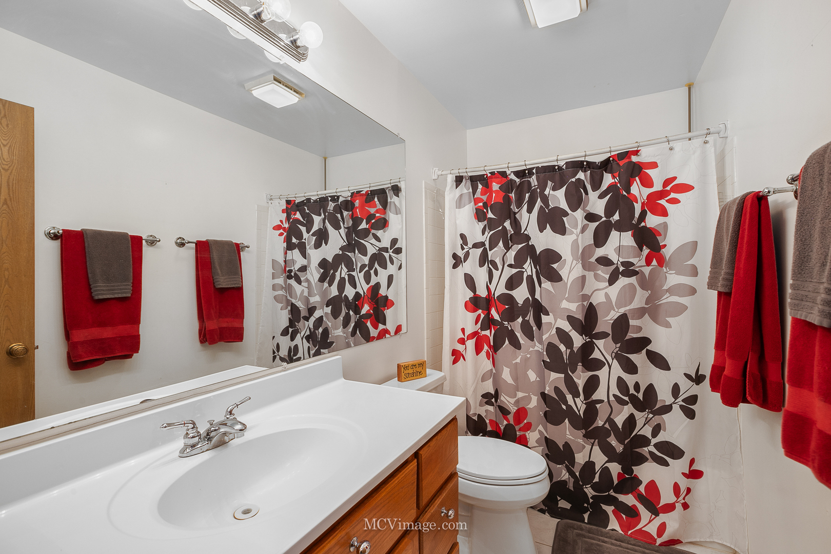 1991 Valley Road Lombard, IL 60148 - Photo 24 of 40 a bathroom with a sink and a toilet