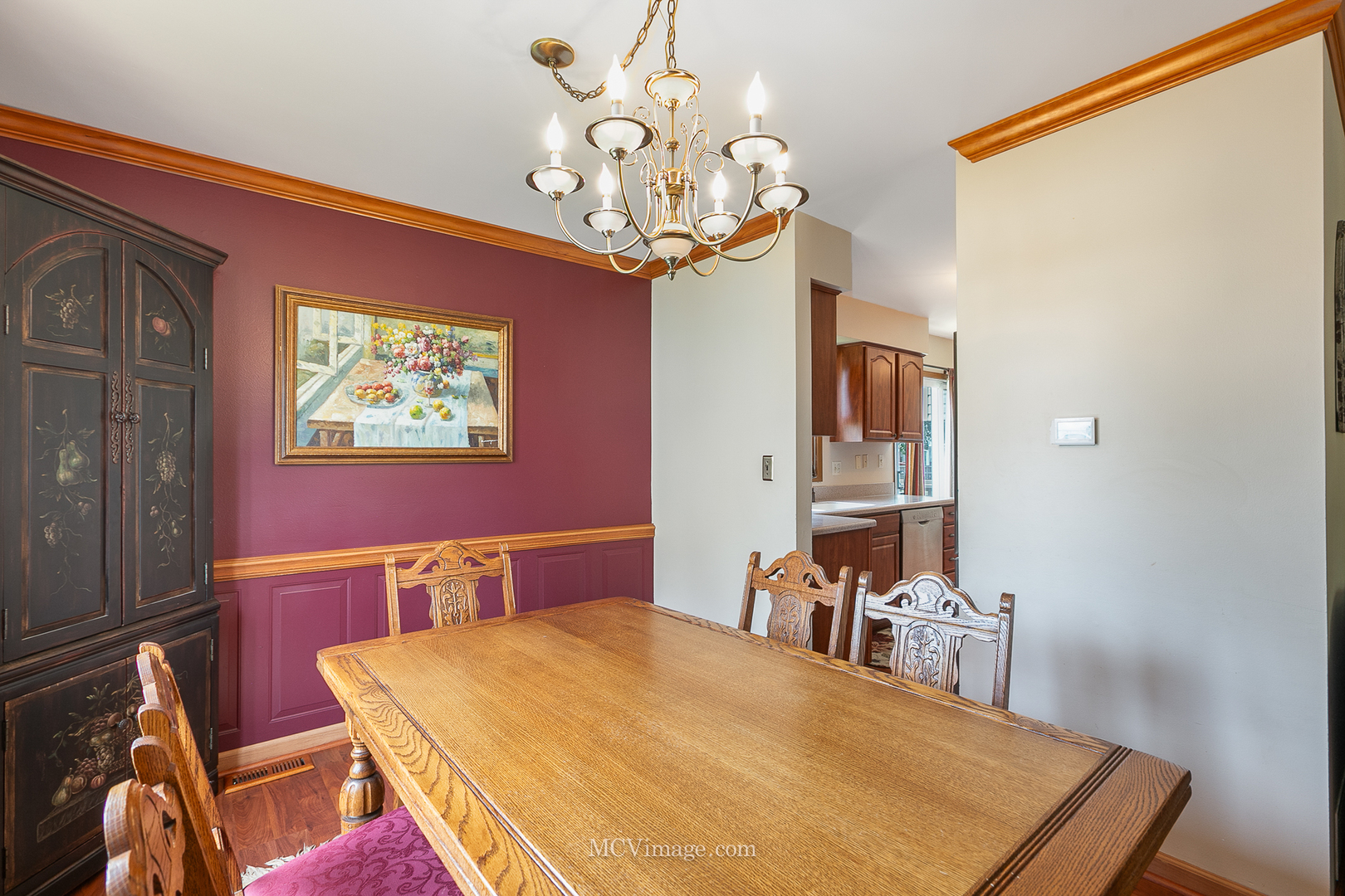 1991 Valley Road Lombard, IL 60148 - Photo 8 of 40 a dining room with wooden floor a chandelier a wooden table and chairs