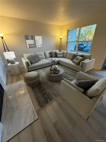 a living room with furniture and a large window