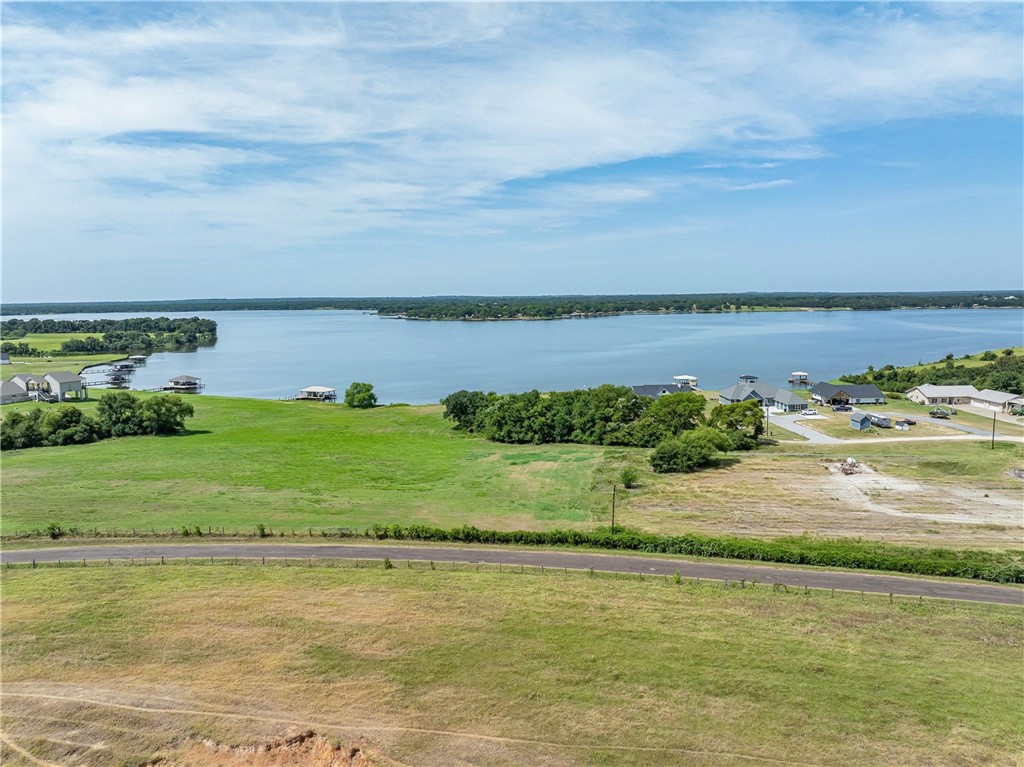 a view of a lake with a big yard