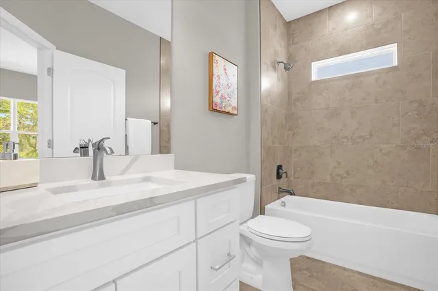 a bathroom with a sink a toilet and a bathtub