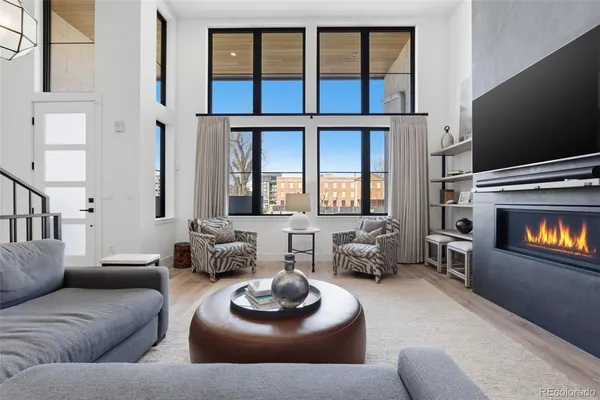 a living room with furniture fireplace and a flat screen tv