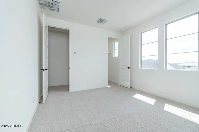 an empty room with windows